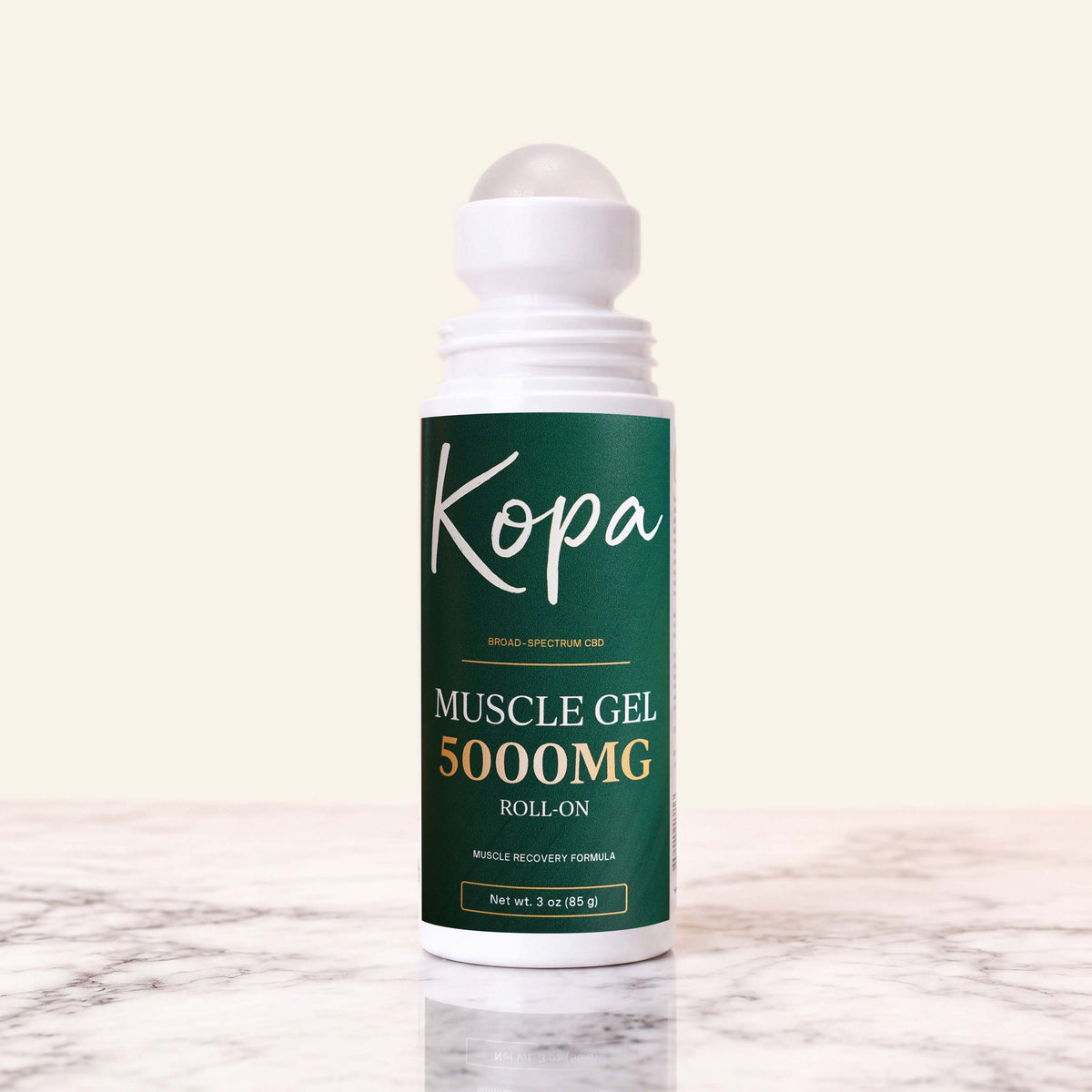 Kopa Muscle Gel Roll-On 5000mg with the cap removed, showing the roller ball applicator