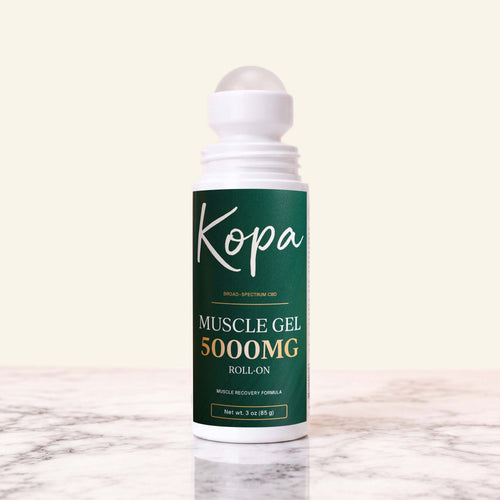 Kopa Muscle Gel Roll-On 5000mg with the cap removed, showing the roller ball applicator